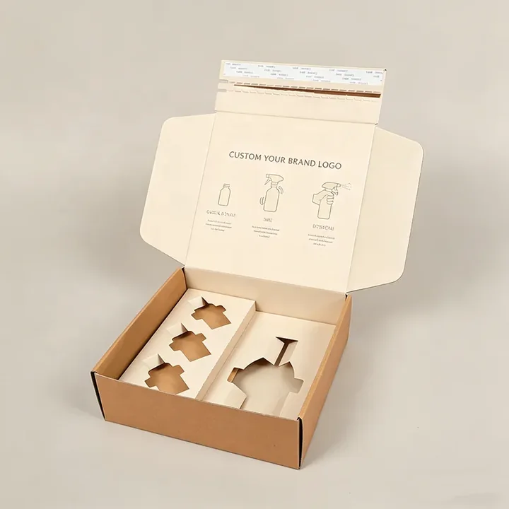 Open corrugated mailer box with fitted paperboard insert