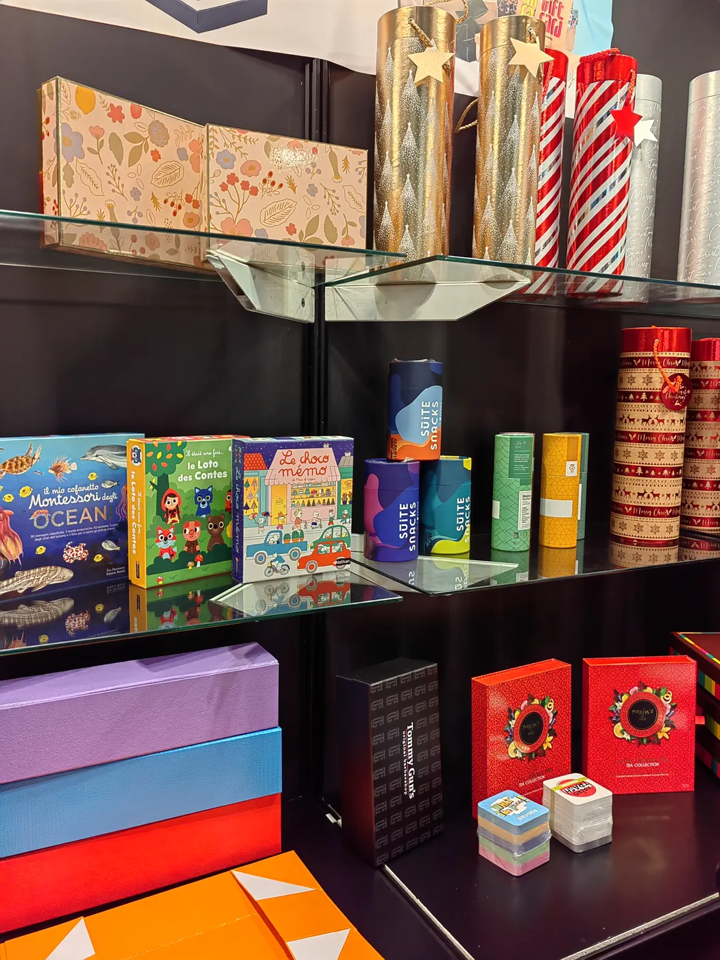 Printed carton and retail packaging samples displayed at a trade show