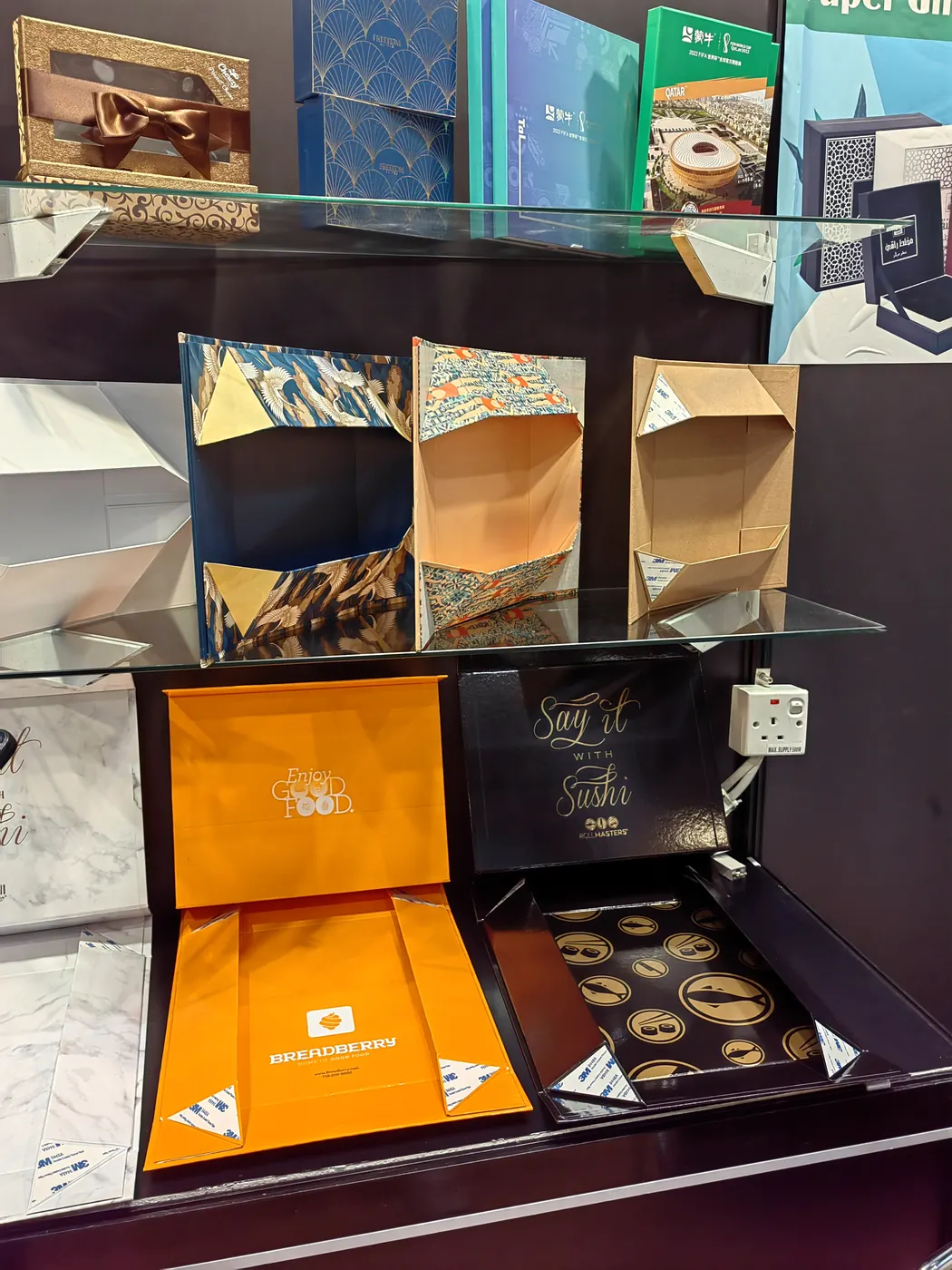 Open rigid and gift box samples displayed at an XLY packaging exhibition booth