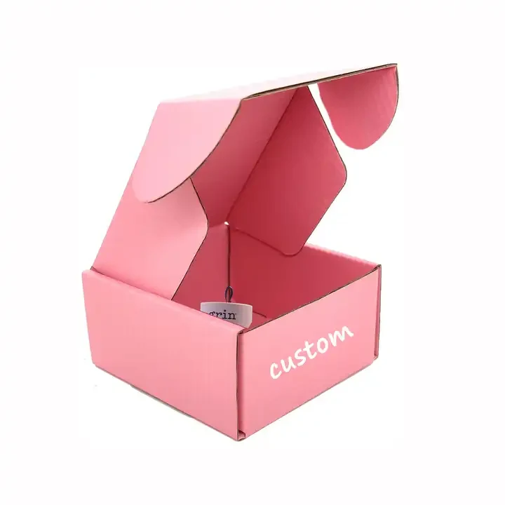Open pink corrugated mailer with a tuck-in lid — subscription box structure reference
