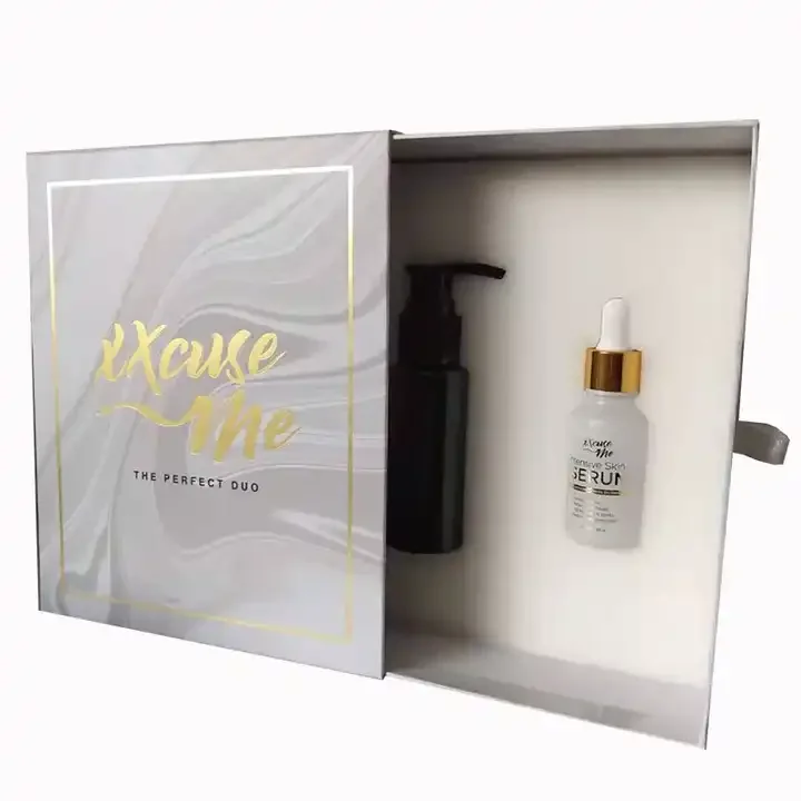 Open skincare presentation box holding a pump bottle and a dropper serum bottle