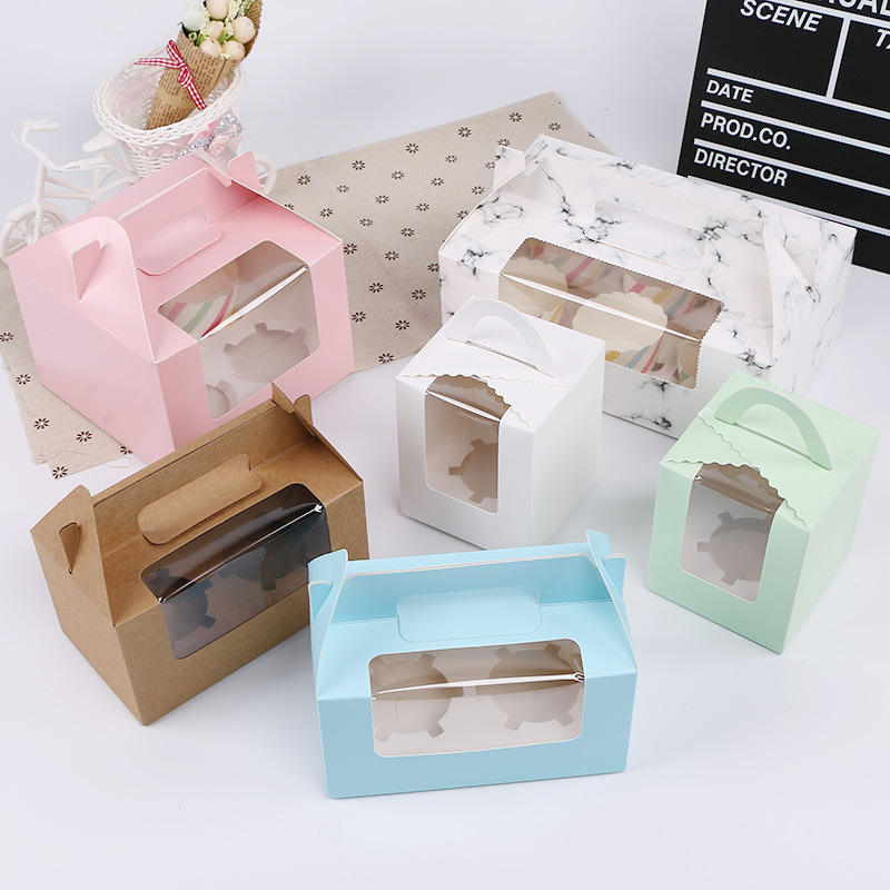 Window bakery cartons with carry handles and visible single and double cupcake inserts