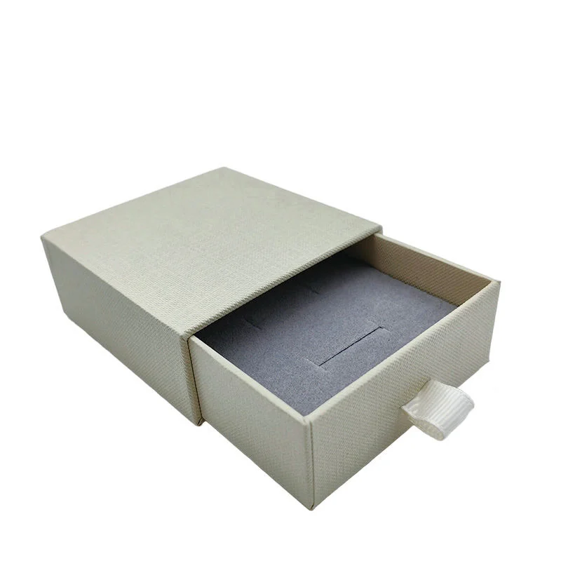 Champagne-colored jewelry drawer box with sliding tray
