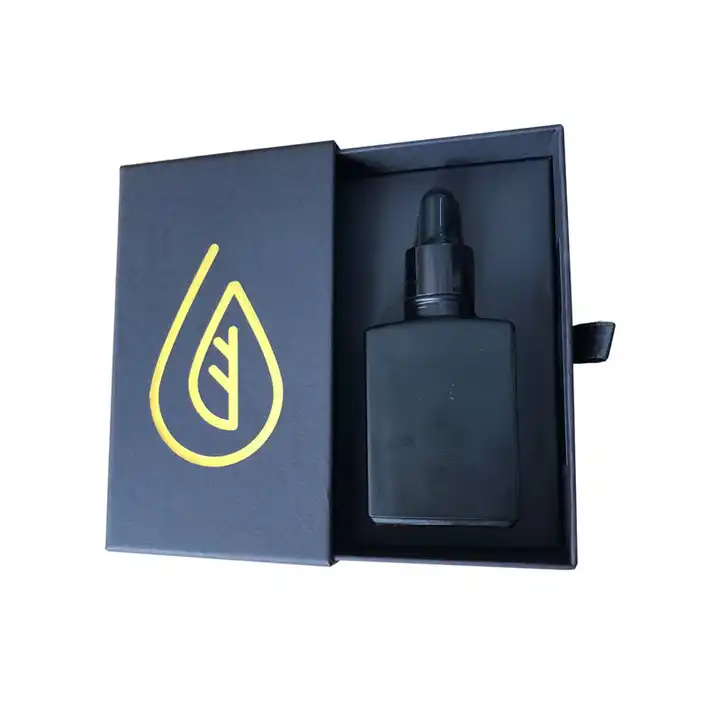 Open dark drawer-style rigid box with a fitted insert holding a dropper bottle