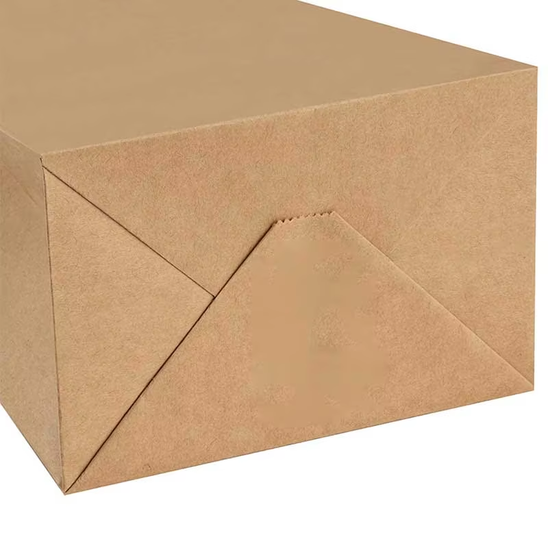 Close-up of the folded bottom construction of a brown kraft paper bag