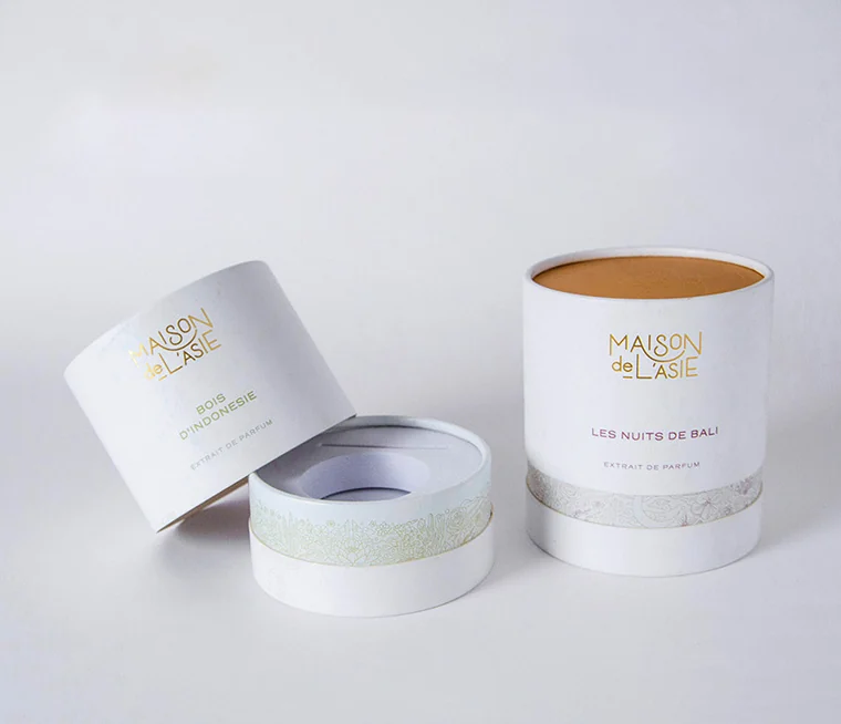 Open white cylindrical candle presentation boxes with removable lids and fitted bases